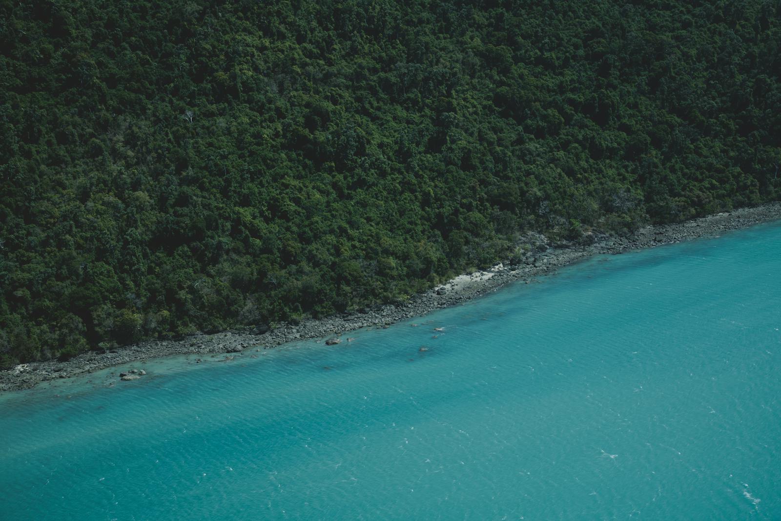 Aerial drone view of turquoise Menorca coastline for tourism content